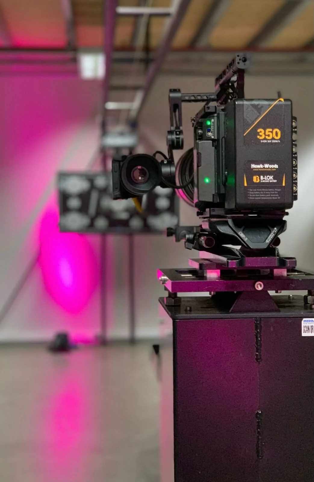 A cinema camera rigged on set during a Nala Media production